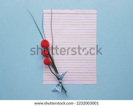 Blank paper on a blue background.