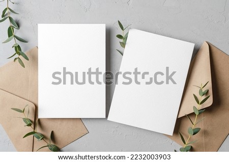 Wedding invitation card mockup with envelopes and eucalyptus, front and back sides