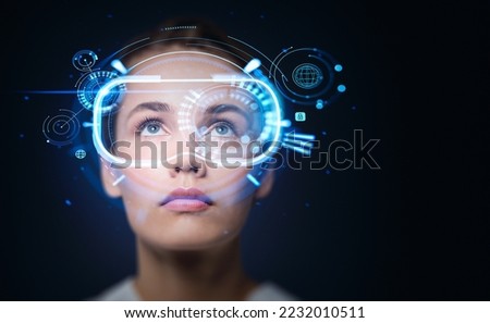 Businesswoman look up portrait in vr glasses hologram, glowing virtual headset with connection, earth sphere and lines. Concept of metaverse Royalty-Free Stock Photo #2232010511