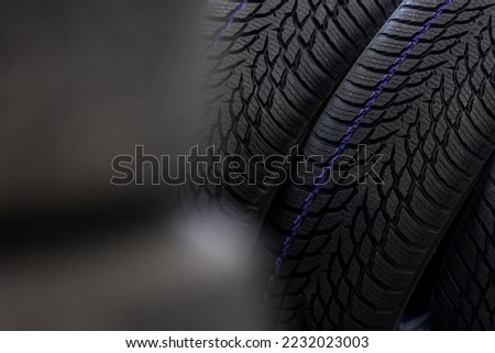 Close up of new winter tires for the cold season, vehicle service concept