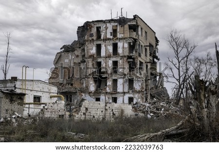 destroyed and burned houses in the city during the war in Ukraine Royalty-Free Stock Photo #2232039763