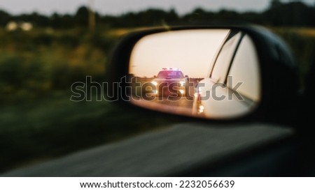 Stylish Side Mirror Car Chase Shot: Highway Traffic Patrol Vehicle Pull over Suspect. Professional Female Police Officer Approaches Vehicle, Asks Driver License and Registration. Cinematic Shot Royalty-Free Stock Photo #2232056639