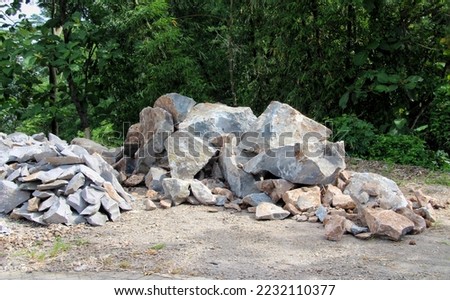 pile of foundation stones that are still in the process of breaking