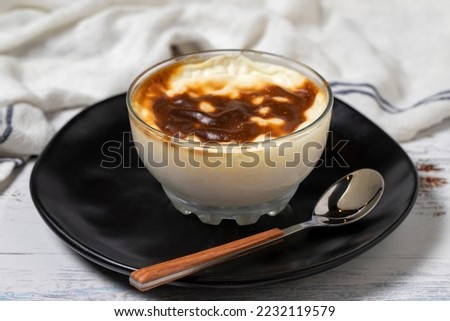 Rice Pudding on a white wood background. Turkish cuisine delicacies. close up