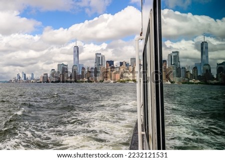 Downtown of Manhattan with a reflection in the cruise ship.