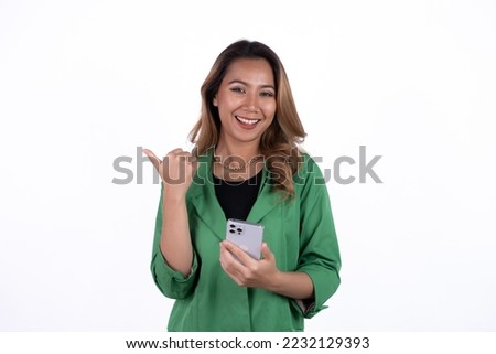 Studio shot of beautiful business asian woman holding smartphone and smiling on light white background.