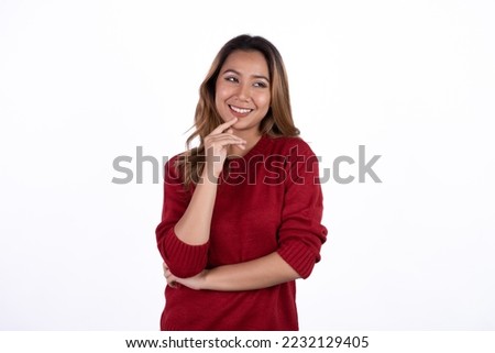Excited young asian woman with raised hand celebrating success Portrait cheerful positive asian female with raised hands and fists open mouth Girl get happy enjoy life Light white background.