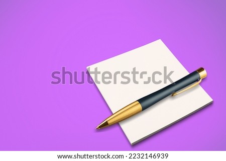 A pen and blank paper note on office desk