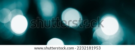 Blurred lights, dark blue background, banner texture. Abstract bokeh with soft light header. Wide screen wallpaper. Panoramic web banner with copy space for design