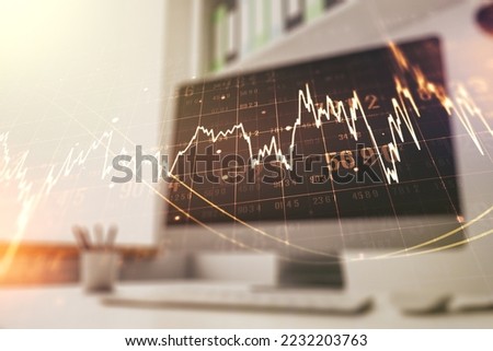 Double exposure of abstract creative financial diagram and modern desk with computer on background, banking and accounting concept