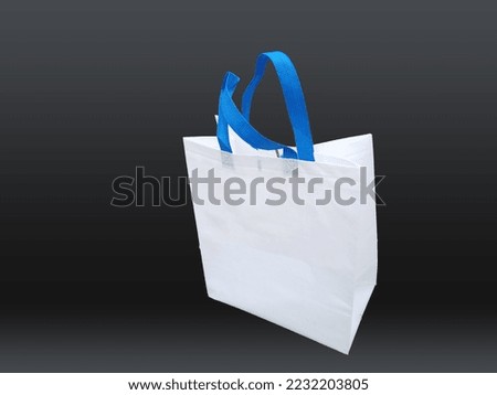Beautiful Non Woven white fabric grocery shopping bag with black background