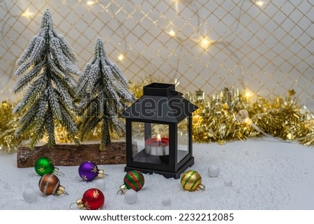 Christmas decoration with lights in the background.