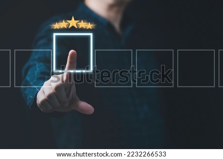 Businessman hand touching virtual empty box with golden five stars for add selection item , Excellent customer evaluation concept after use product and service concept. Royalty-Free Stock Photo #2232266533
