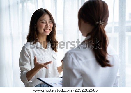 Entrepreneur Asian businesswoman discussing new business project in tablet in modern Meeting In Modern Office, Asian business casual concept. Royalty-Free Stock Photo #2232282585