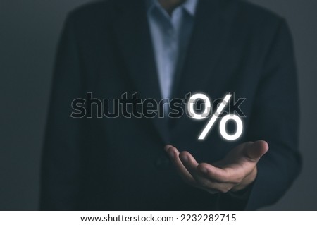 Businessman hands showing percentage symbol icon. The concept of investing in the business of increasing profits of stocks. Finance, marketing, sales, interest rates Better economy, and discounts