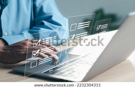  Questionnaire with checkboxes, filling survey form online, answer questions of test. Survey form concept. Education futuristic technology and learning concept.	 Royalty-Free Stock Photo #2232304315