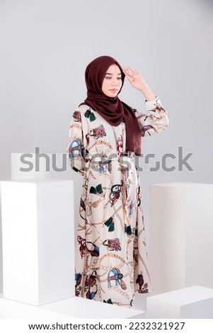 studio portrait of young business woman with hijab fashion on isolated plain background. Corporate people business working concept.