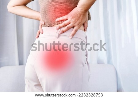 woman suffering from lower back pain spreading to buttocks, Sciatica pain concept 