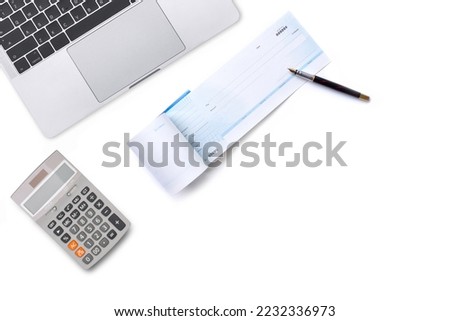 Mockup image of checkbook, pen, laptop computer and calculator isolated on white background. Payment by cheque, paycheck or payroll concept. Top view. Flat lay. Royalty-Free Stock Photo #2232336973