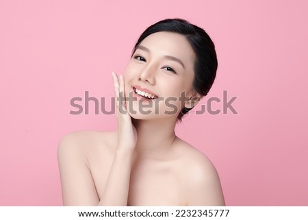 Beautiful young asian woman with clean fresh skin on pink background, Face care, Facial treatment, Cosmetology, beauty and spa, Asian women portrait.
