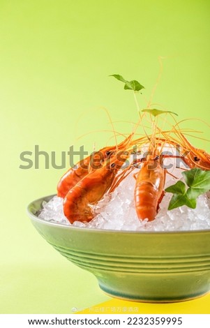 iced shrimp on plate, chinese drunk shrimp, also known as drunken prawns,is a popular dish in parts of China based on freshwater shrimp that are sometimes eaten cooked or raw. Royalty-Free Stock Photo #2232359995