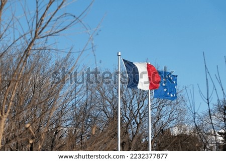 The Flag of France and Flag of Europe are seen together at the Embassy of France in Ottawa, Canada's capital city.