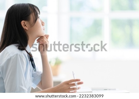 middle school student studying at home Royalty-Free Stock Photo #2232383099