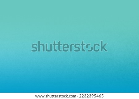 Plain smooth light green gradation with blue two tone color paint on recycled cardboard box blank paper texture minimal background