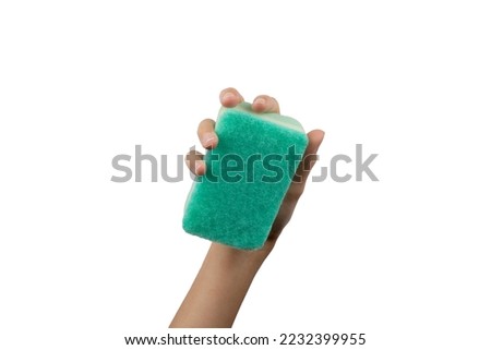 Female hand holding a sponge on white background