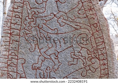 Runestone with beautiful animals ornaments, Olsbrostenen