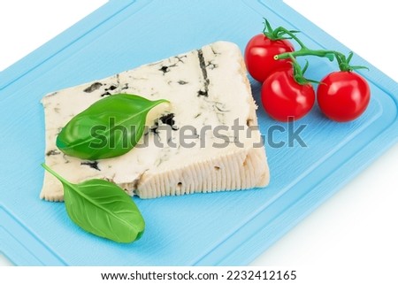 Blue cheese gorgonzola on the board isolated on white background with full depth of field.