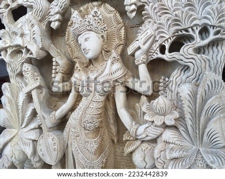 Balinese Handmade Wood Saraswati Carving Wood Carving, Sculpture, Art from Bali Indonesia Royalty-Free Stock Photo #2232442839