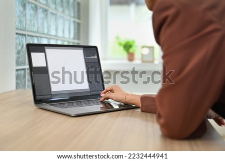 Image of female video editor working with footage and post production montage in creative office studio