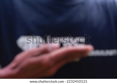 view of man expressing gratitude with hands. defocused and blurred image of male hands in prayer position. practice self-care for well-being.