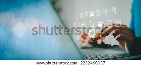 Cloud computing concept. Businessman using computer to backup storage data Internet technology. backup online documentation database and digital file storage system or software, file access. Cloud.. Royalty-Free Stock Photo #2232460057