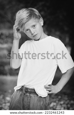 Young boy posing outdoor in skate park for monochrome book photos