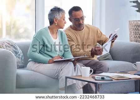 Finance, documents and senior couple on sofa with bills, paperwork and insurance checklist in home, life or asset management, Elderly black people on couch with financial, retirement or mortgage debt Royalty-Free Stock Photo #2232468733