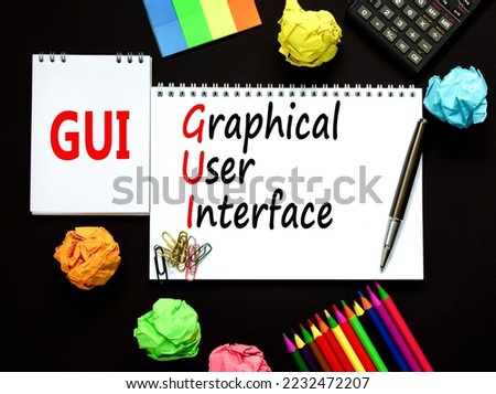 GUI graphical user interface symbol. Concept words GUI graphical user interface on white note on a beautiful black background. Business and GUI graphical user interface concept. Copy space.