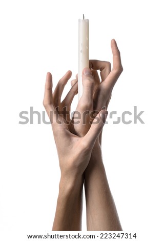 Hands holding a candle, white candle, studio, isolated, white background, praying, church, store, heat, faith, soul, religion, prayer, symbol