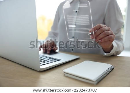 Concept of electronic signature. Woman working on laptop at table indoors, closeup