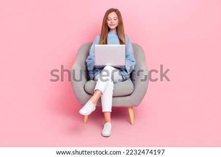 Full body photo of young focused confident teenager girl junior coder sit couch chair hold laptop chatting online isolated on pink color background Royalty-Free Stock Photo #2232474197