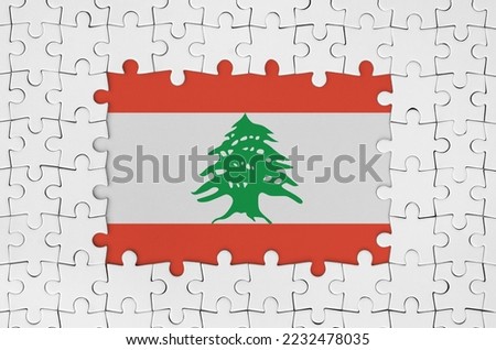 Lebanon flag in frame of white puzzle pieces with missing central parts