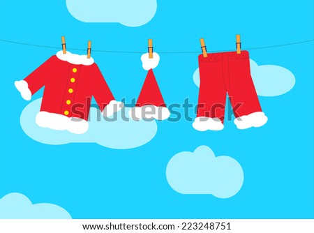 Santa Claus clothes on a clothesline with a blue sky with clouds in background.  EPS vector format.