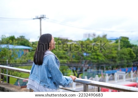 Portrait young girl outdoor with city view.