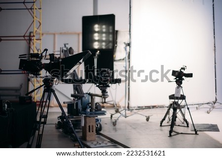 Film set, monitors and modern shooting equipment. Film crew, lighting devices, monitors, playbacks - filming equipment and a team of specialists in filming movies, advertising and TV series Royalty-Free Stock Photo #2232531621