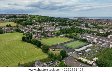 Aerial photo of the grass and 3g Playing fields at Larne Grammar School in Larne County Antrim Northern Ireland Royalty-Free Stock Photo #2232539425