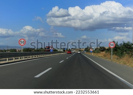 Views of the highway on a sunny day in summer. Roads and cars and blue sky.