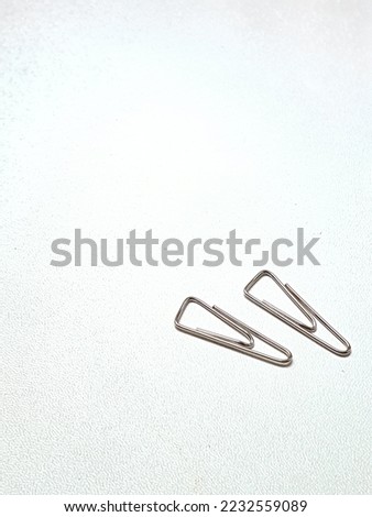 paper clips to hold your documents together without holes in them. Isolated. White background.