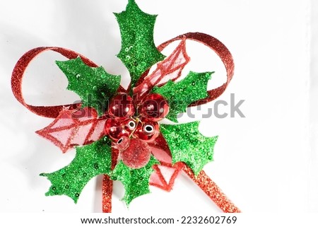 Greeting Holiday Card with red and green ornament, room for text, on a white background.