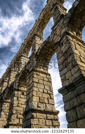 Strolling under the Roman aqueduct of Segovia
